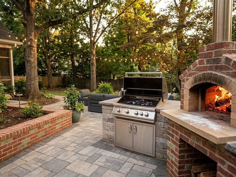 Built-in grill station with pizza oven in Charlotte outdoor kitchen